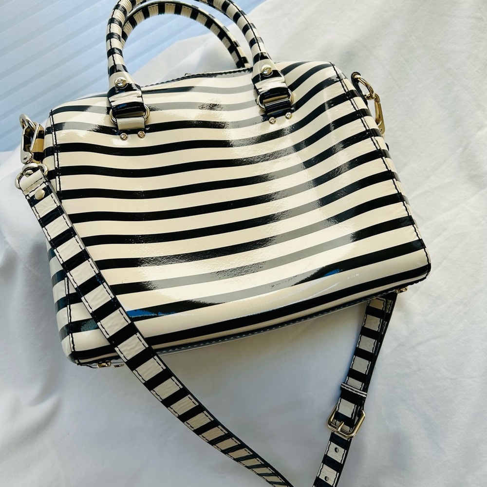 Kate Spade black and cream striped shoulder bag with red inside with zipper